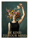 Başı çiçekli kadın ve sulama kabı Be Kind To Your Mind yazılı tablo.
