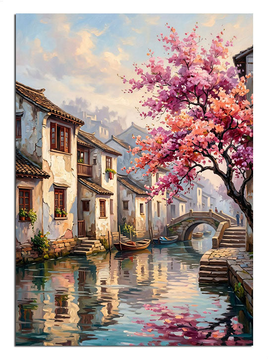Pembe çiçekli ağaç altında kanal ve köprü manzarası tablo.